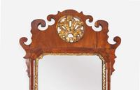 A small Chippendale fret-carved burl walnut and parcel-gilt looking glass, second half 18th century