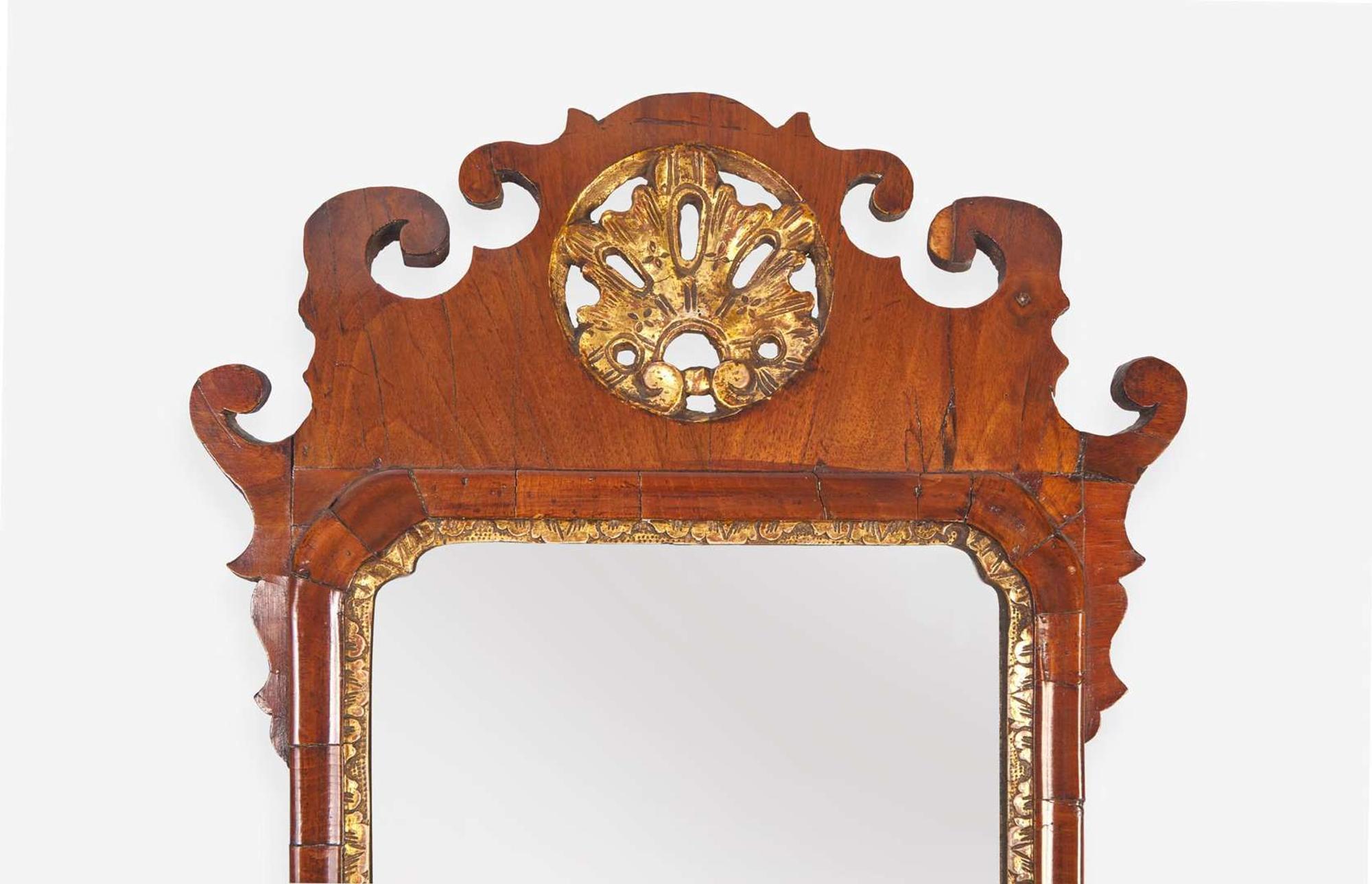 A small Chippendale fret-carved burl walnut and parcel-gilt looking glass, second half 18th century