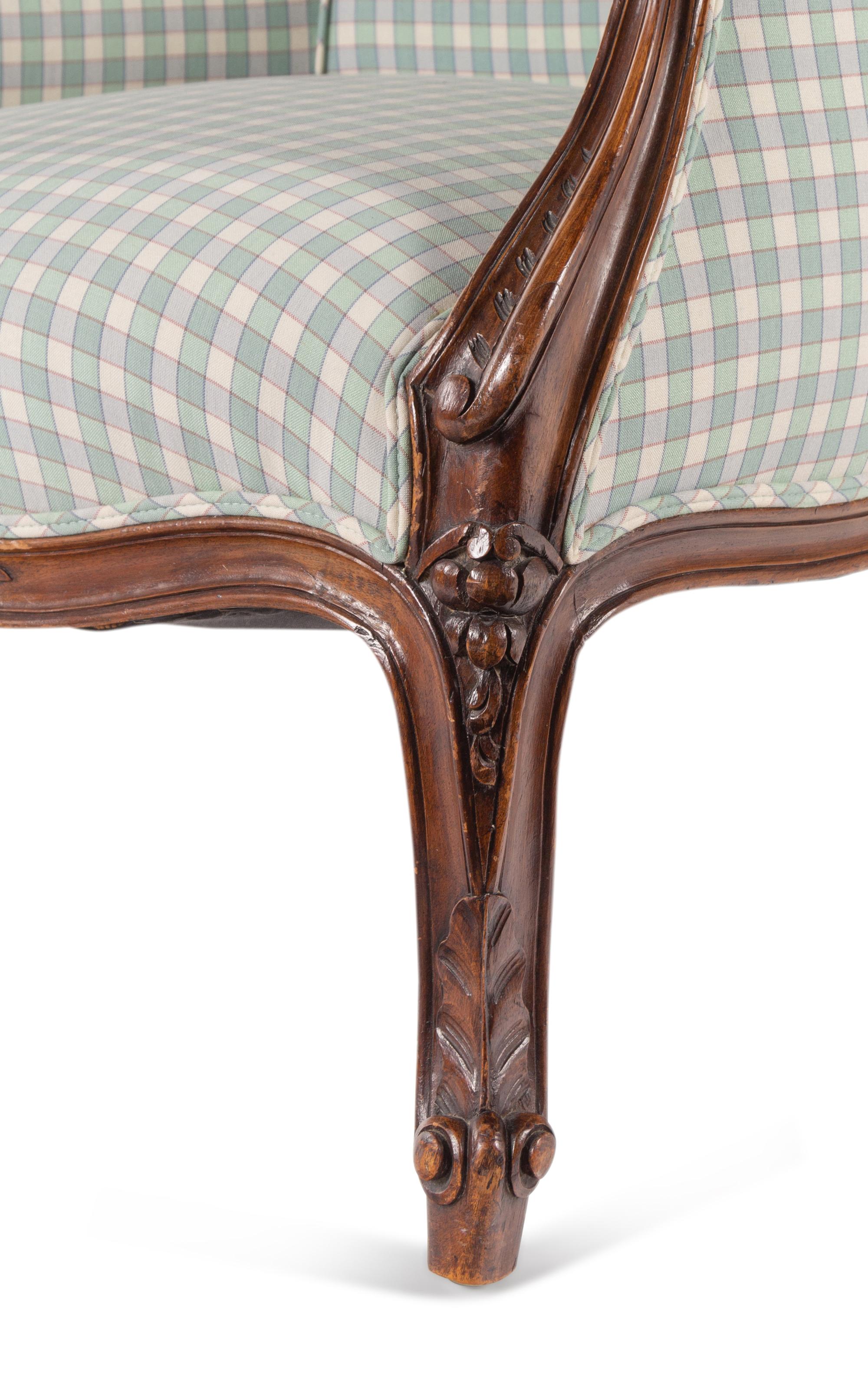 A Louis XV Style Walnut Bergère en Cabriolet
