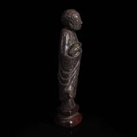 A Chinese carved dark soapstone Luohan 寿山石雕罗汉