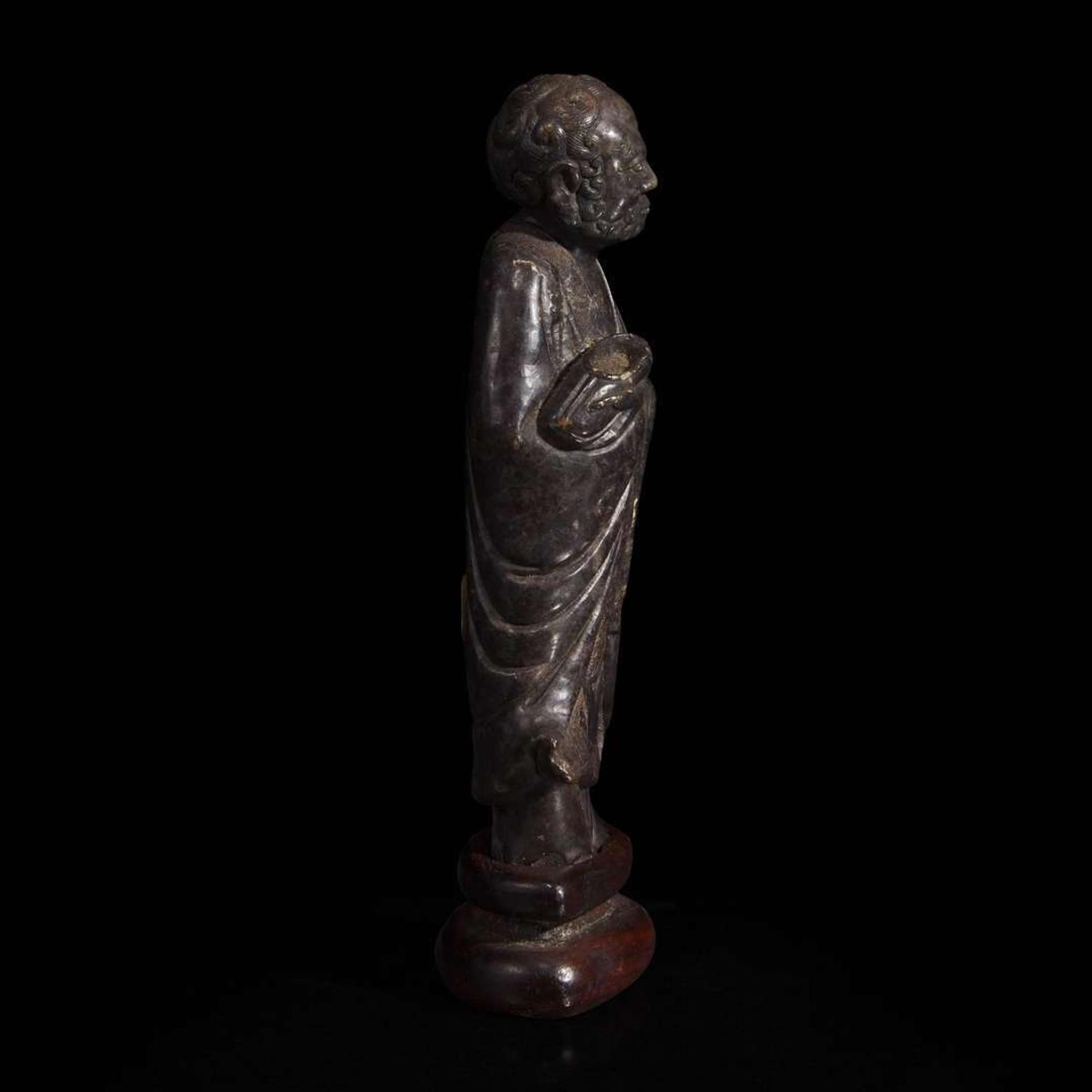 A Chinese carved dark soapstone Luohan 寿山石雕罗汉