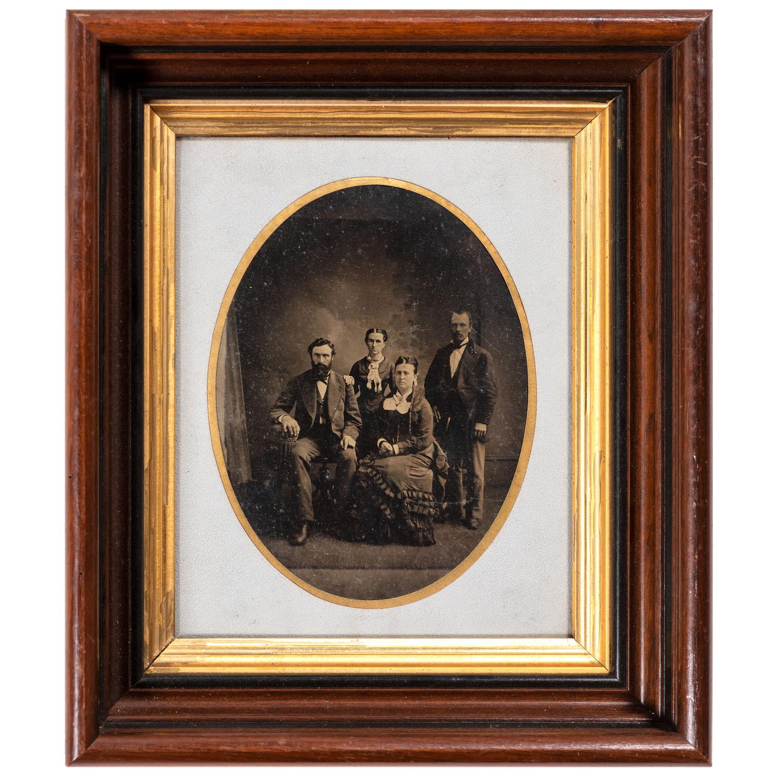 [EARLY PHOTOGRAPHY - PORTRAITURE]. A pair of framed tintypes of groups of people, comprising: