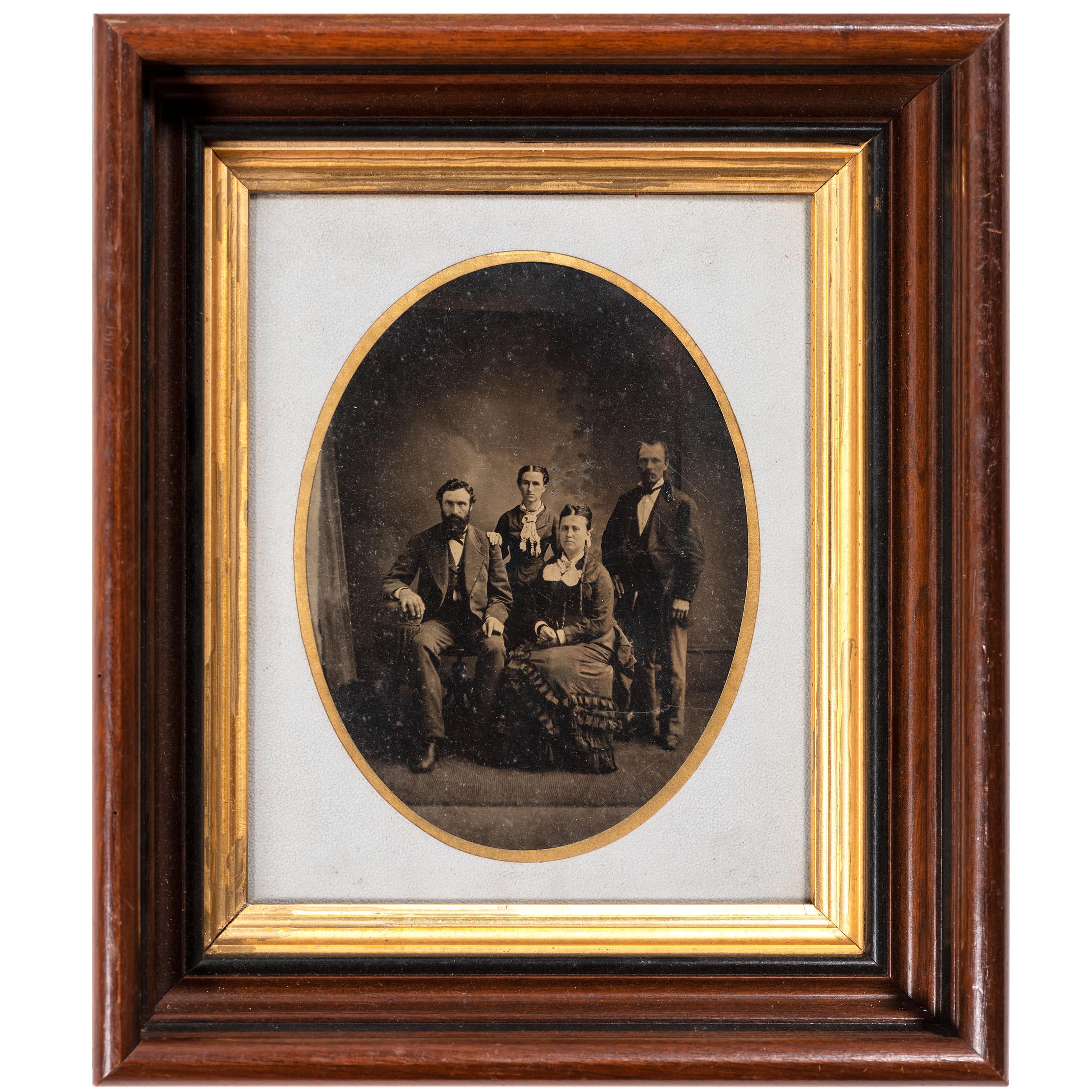 [EARLY PHOTOGRAPHY - PORTRAITURE]. A pair of framed tintypes of groups of people, comprising: