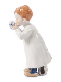 A Meissen Porcelain Figure of a Boy Drinking From Cup, by Konrad Hentschel