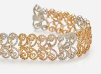A Three-Tone Rose, White, and Yellow Gold and Multicolor Diamond Bracelet
