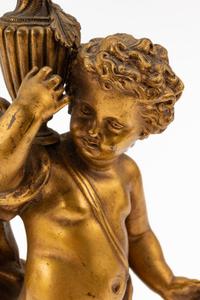 A French Gilt Bronze Figure of a Cherub on a Marble Base