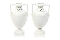A Pair of Berlin (K.P.M.) Blanc de Chine Porcelain Urns