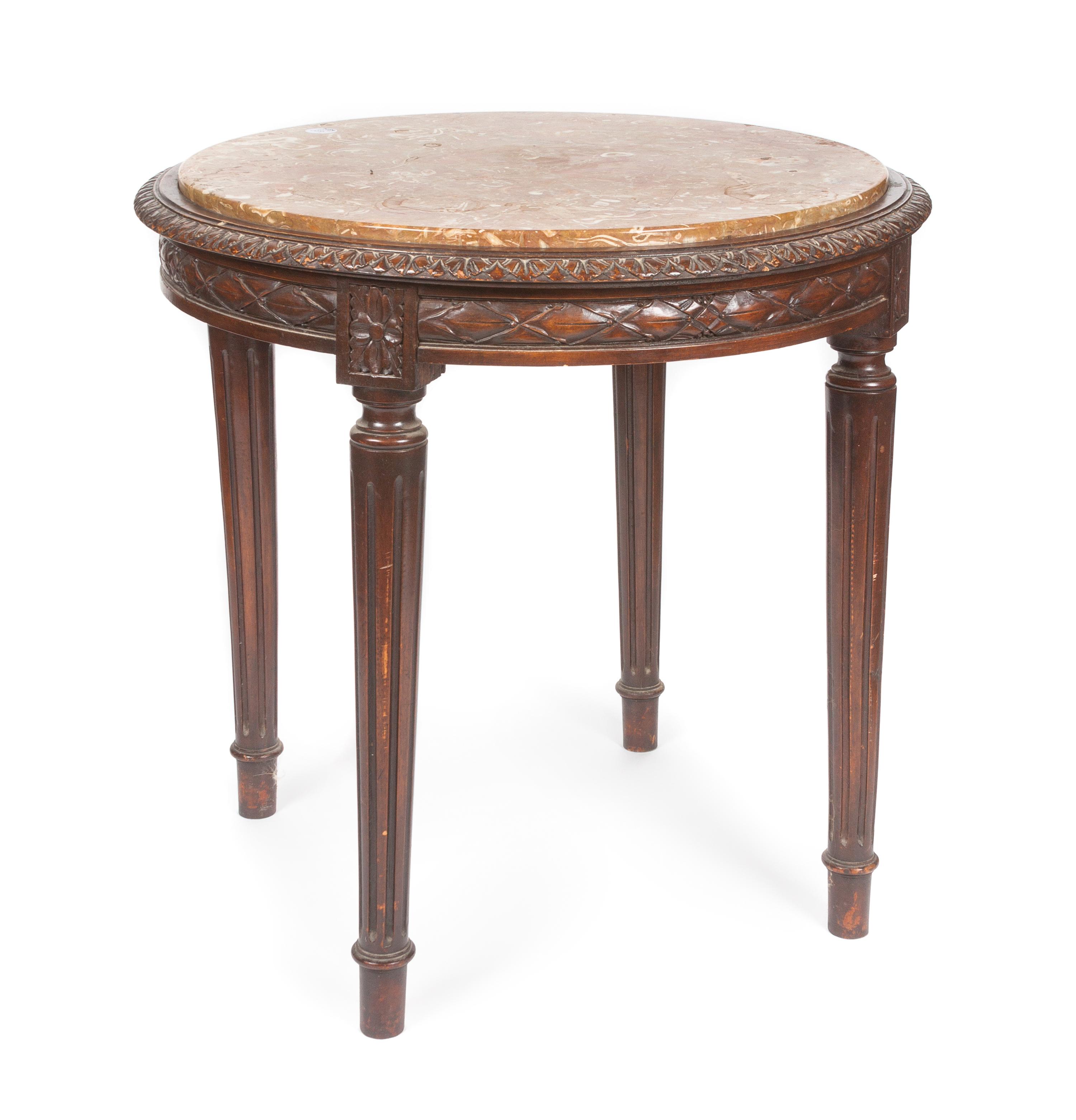 A Louis XVI Style Occasional Table Height 29 1/2 x diameter 23 inches.
