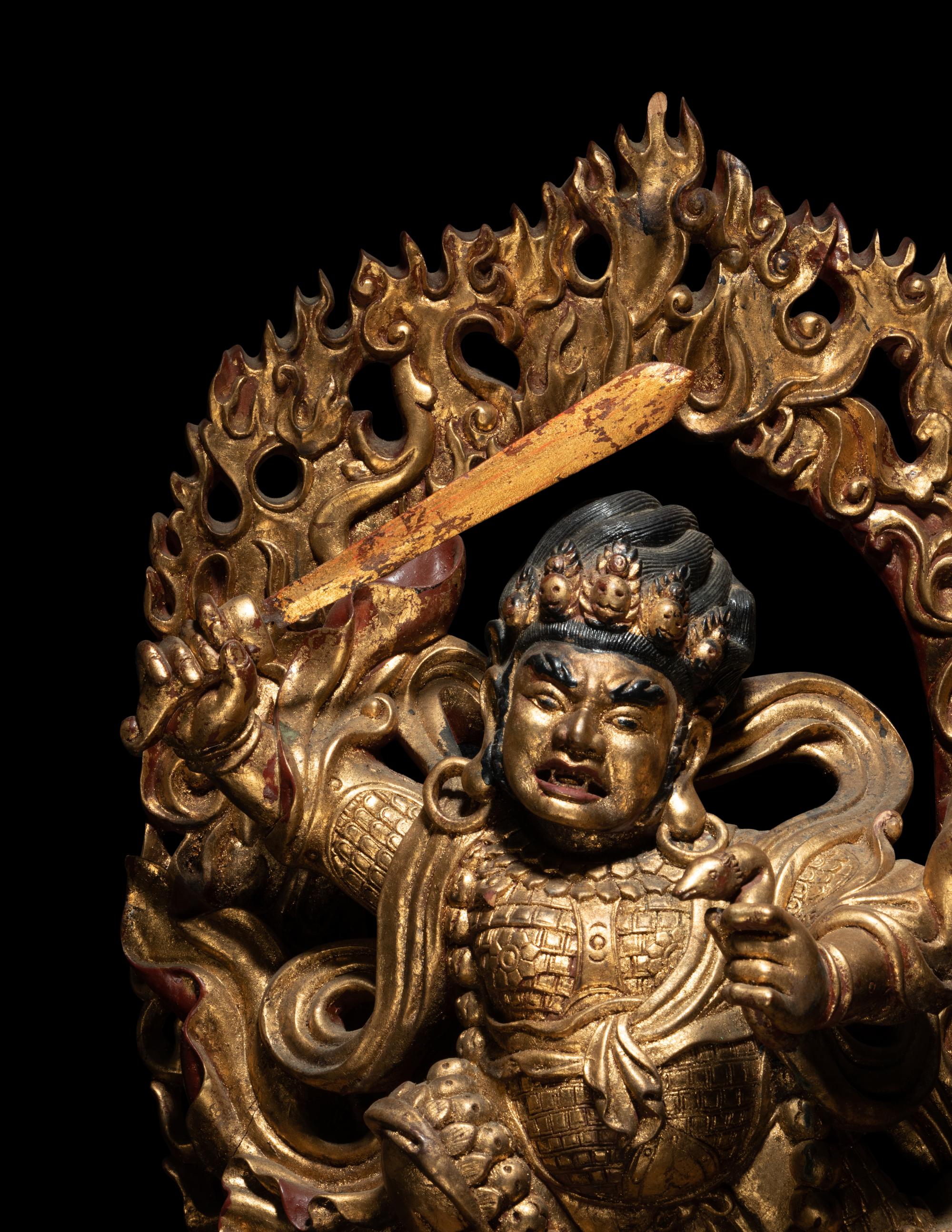 A Large Sino-Tibetan Gilt and Polychrome Lacquered Carved Wood Figure of a Dharmapala