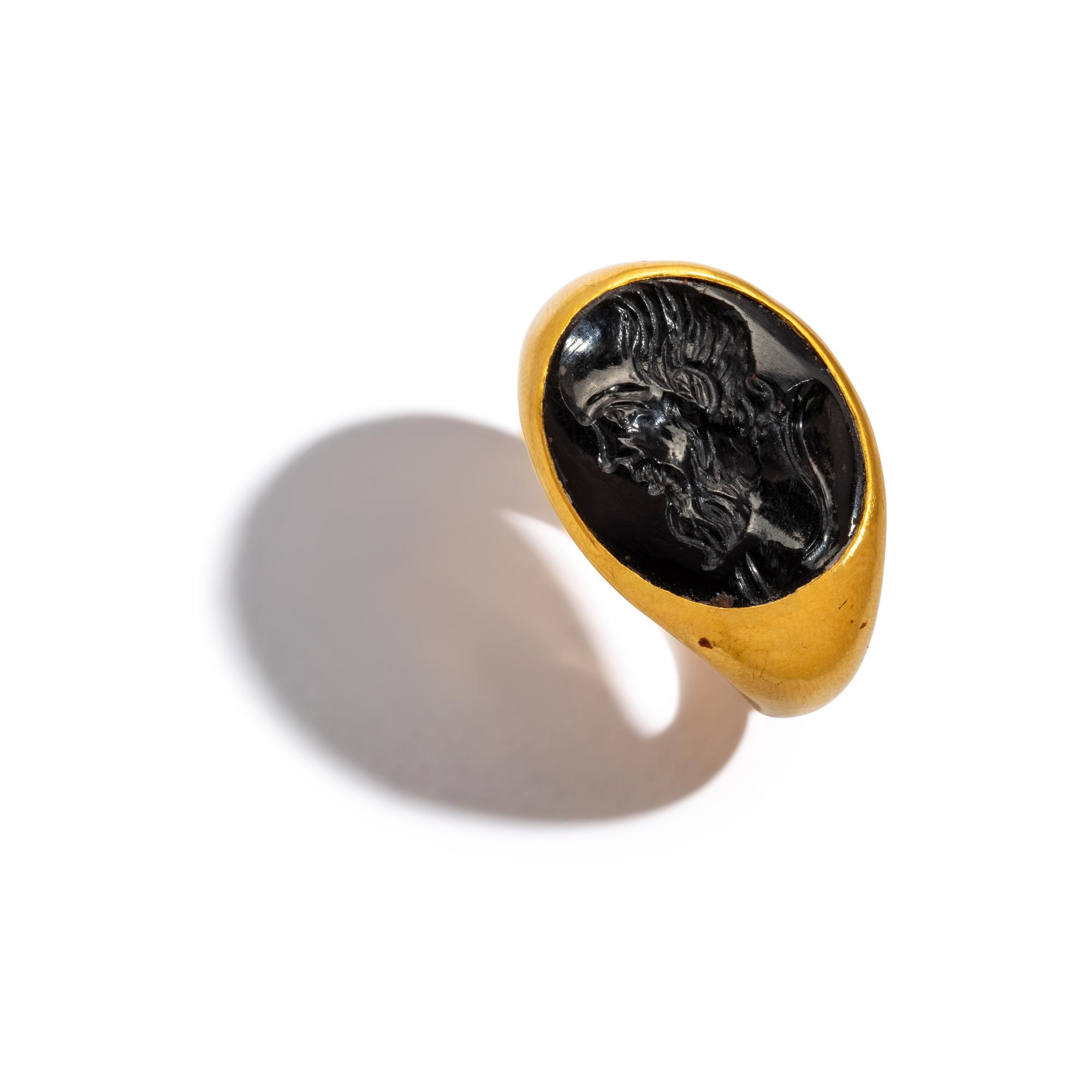 A Roman Black Jasper Intaglio with a Portrait Head of Socrates — Set in a gold ring