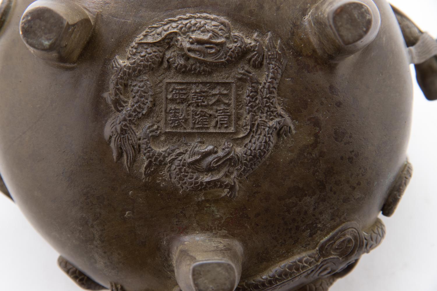 A Chinese Bronze Tripod Chilong Censer Height 4 inches. — 20TH CENTURY
