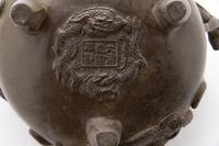 A Chinese Bronze Tripod Chilong Censer Height 4 inches. — 20TH CENTURY