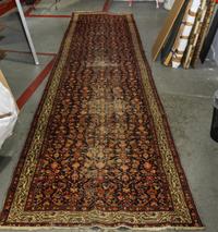 A Persian Runner 15 feet 8 inches x 3 feet 10 inches.