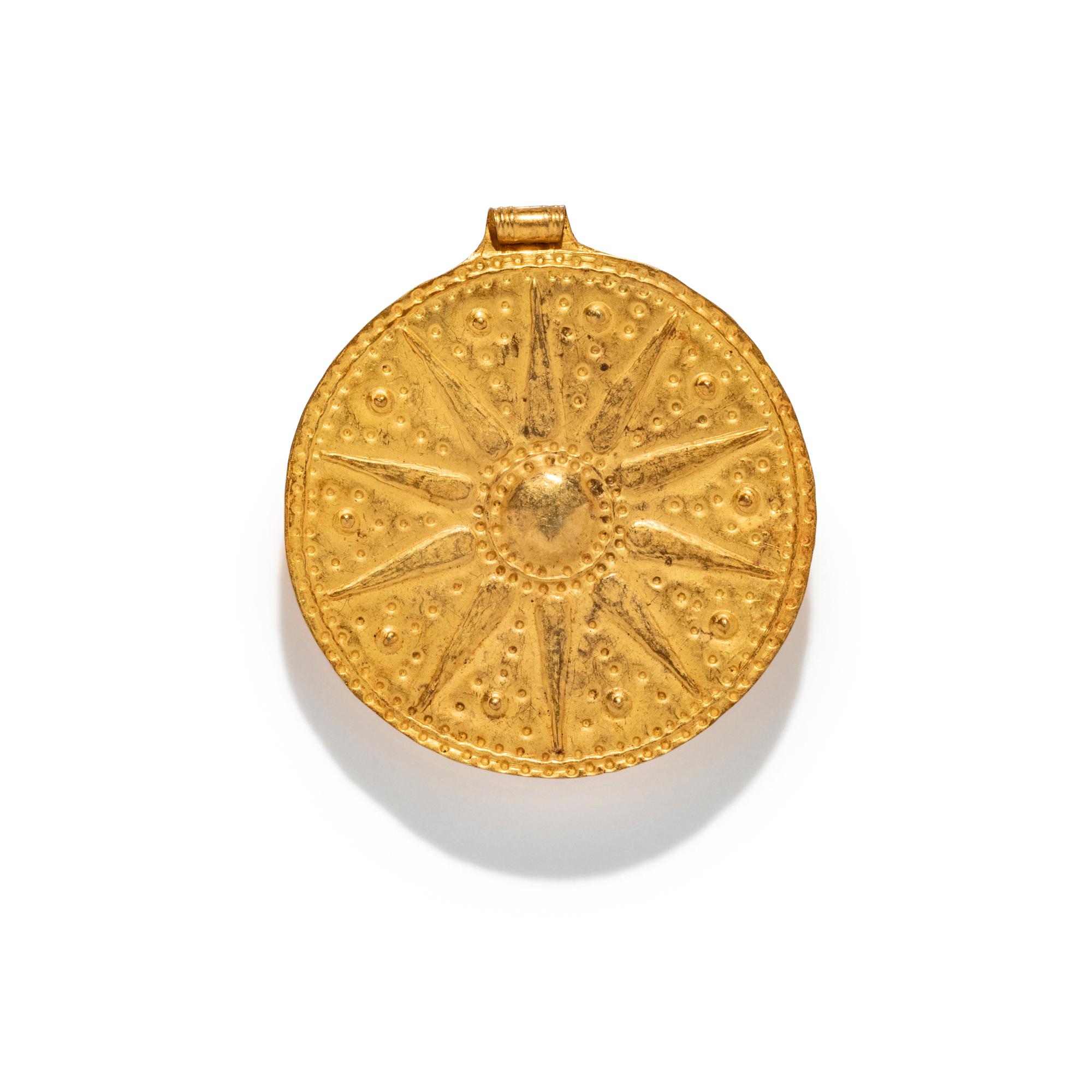 A Near Eastern Gold Disk Pendant