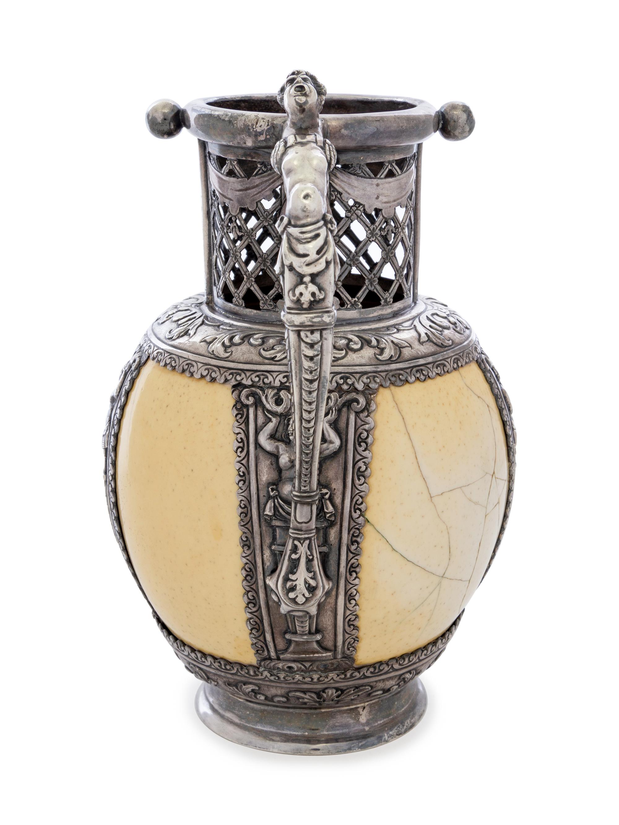 An Austrian Silver Mounted Ostrich Egg Puzzle Jug