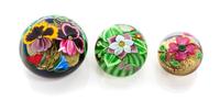 Orient & Flume, CHICO, CA, a group of three glass paperweights