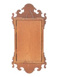 A Chippendale Carved and Parcel Gilt Mahogany Eagle-Decorated Looking Glass