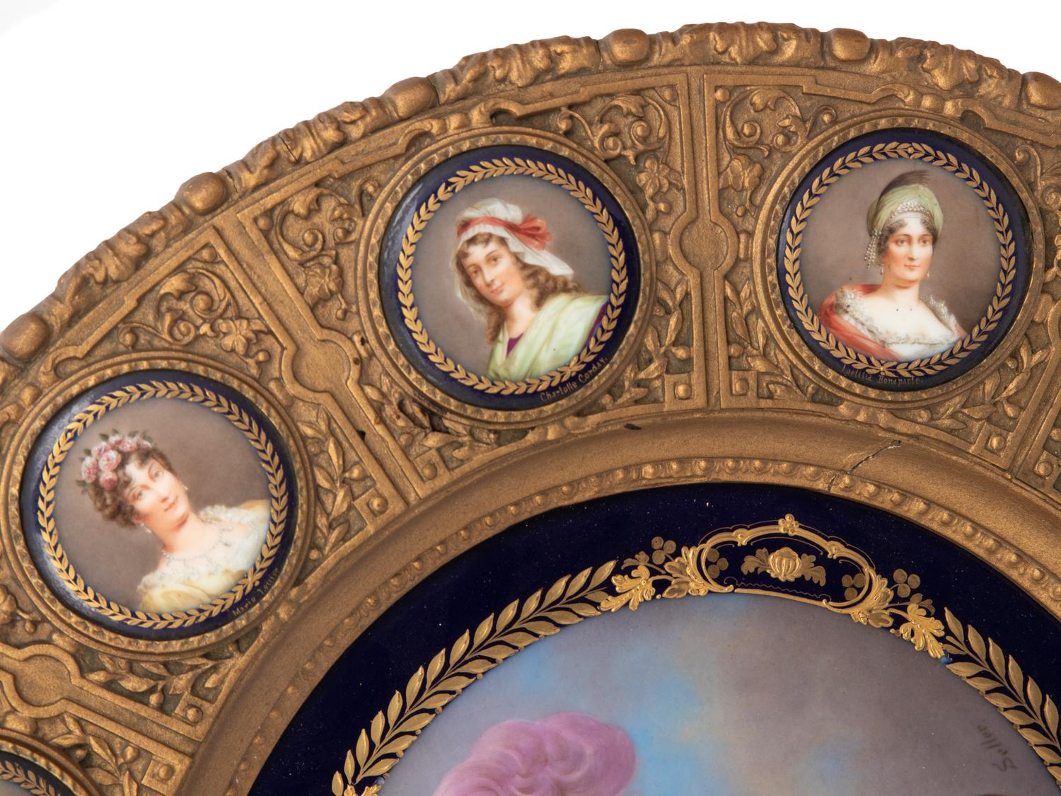 A Continental Porcelain Portrait and a Set of Twelve Similar Medallions in a Gilt Bronze Plaque