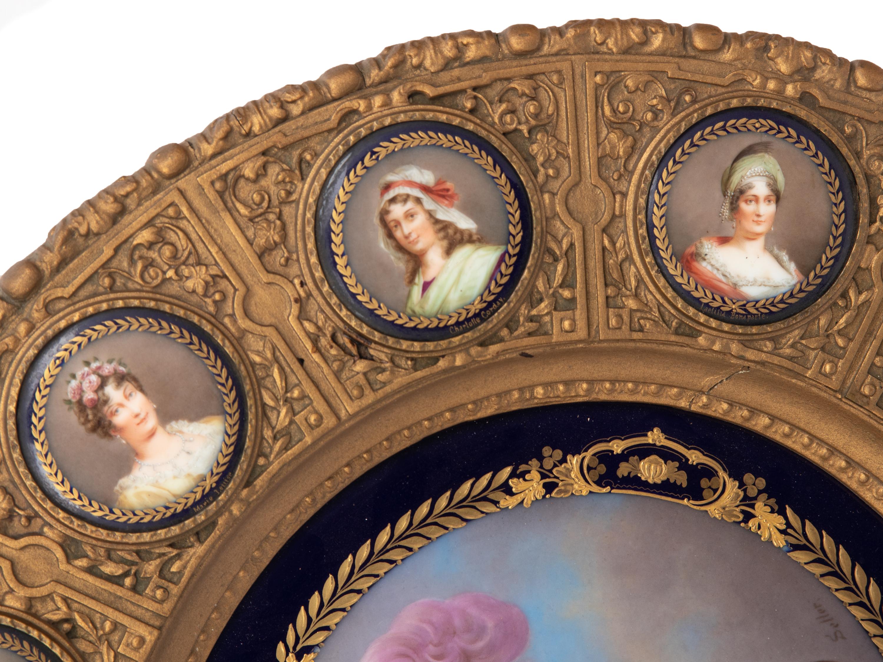 A Continental Porcelain Portrait and a Set of Twelve Similar Medallions in a Gilt Bronze Plaque