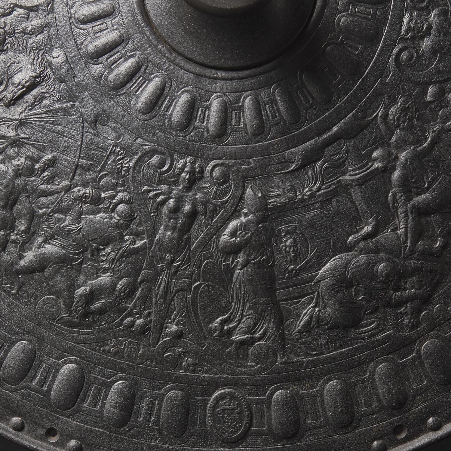 A Victorian Iron Parade Shield with Scenes from the Life of Julius Caesar
