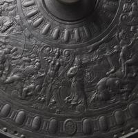 A Victorian Iron Parade Shield with Scenes from the Life of Julius Caesar