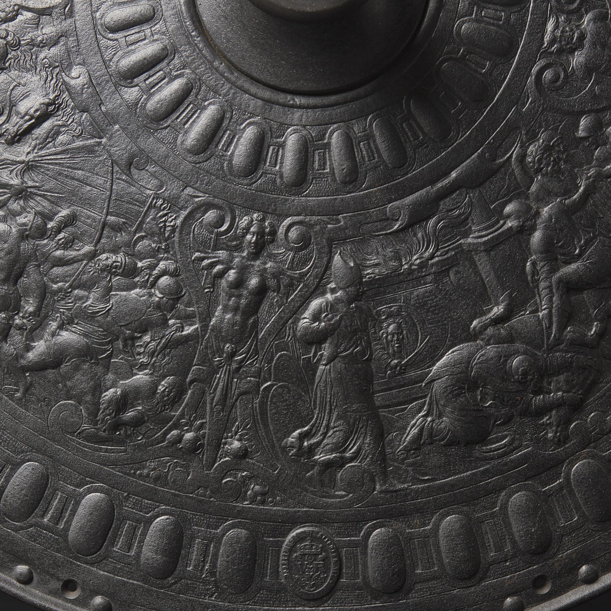 A Victorian Iron Parade Shield with Scenes from the Life of Julius Caesar
