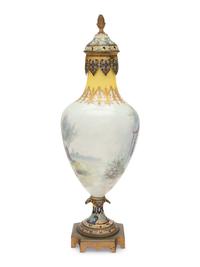 A Sèvres Style Gilt Bronze and Champlevé Enamel Mounted Porcelain Vase and Cover