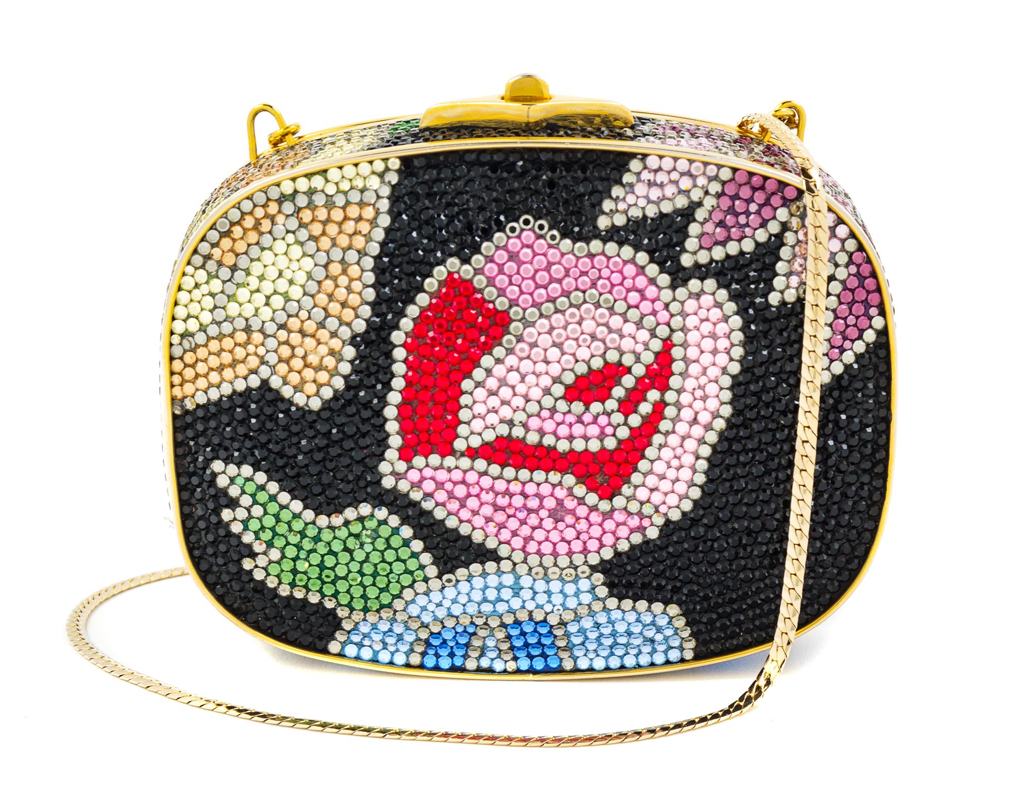 A Judith Leiber Black Floral Minaudiere, 3.75"H x 5"W x 1"D; Strap drop: 19.5".