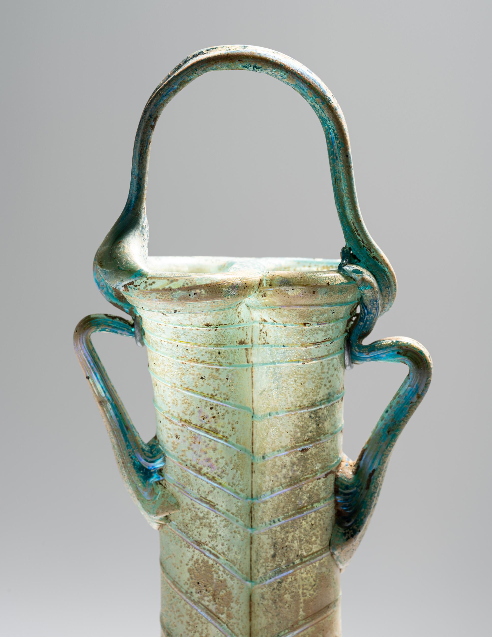 A Roman Green Glass Double Unguentarium