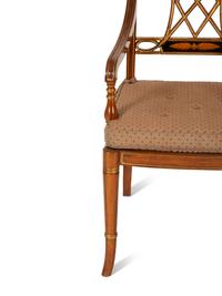 A Regency Style Rosewood and Parcel Gilt Open Armchair