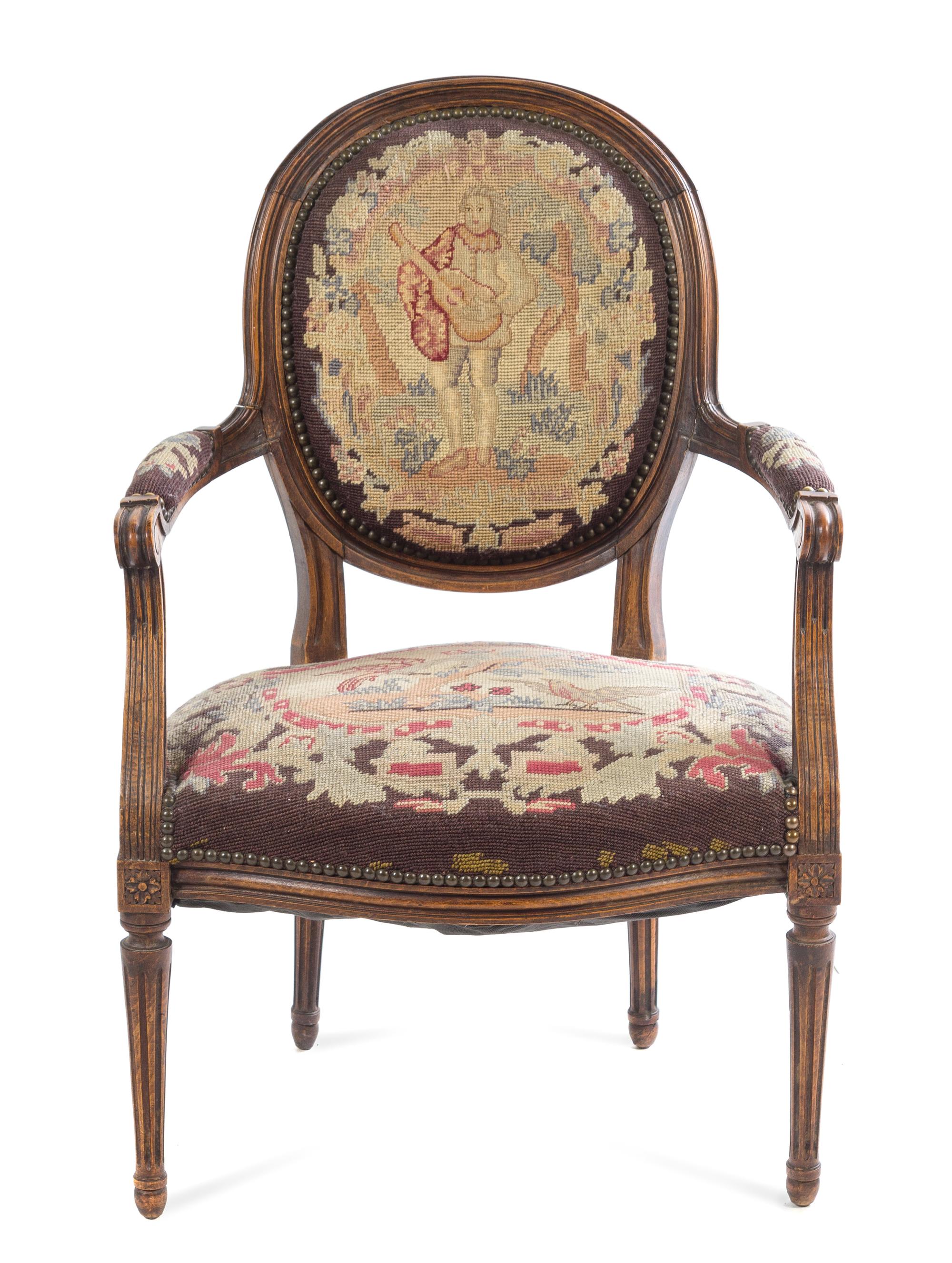 A French Carved Walnut Fauteuil Height 34 1/2 inches. — 19TH CENTURY