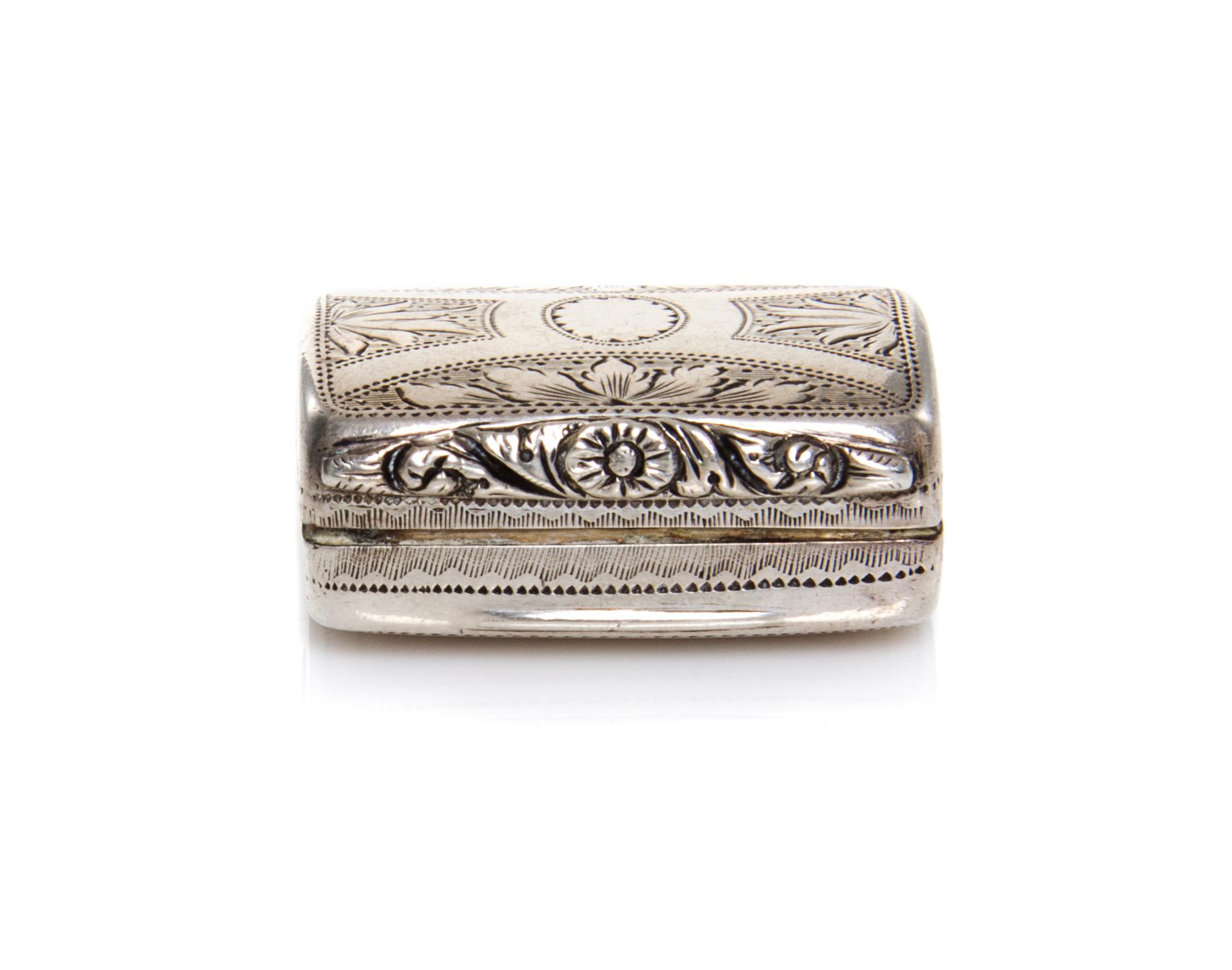 A George IV Silver Vinaigrette, Joseph Taylor, Birmingham, 1825, of rectangular, hinged form with foliate decoration.