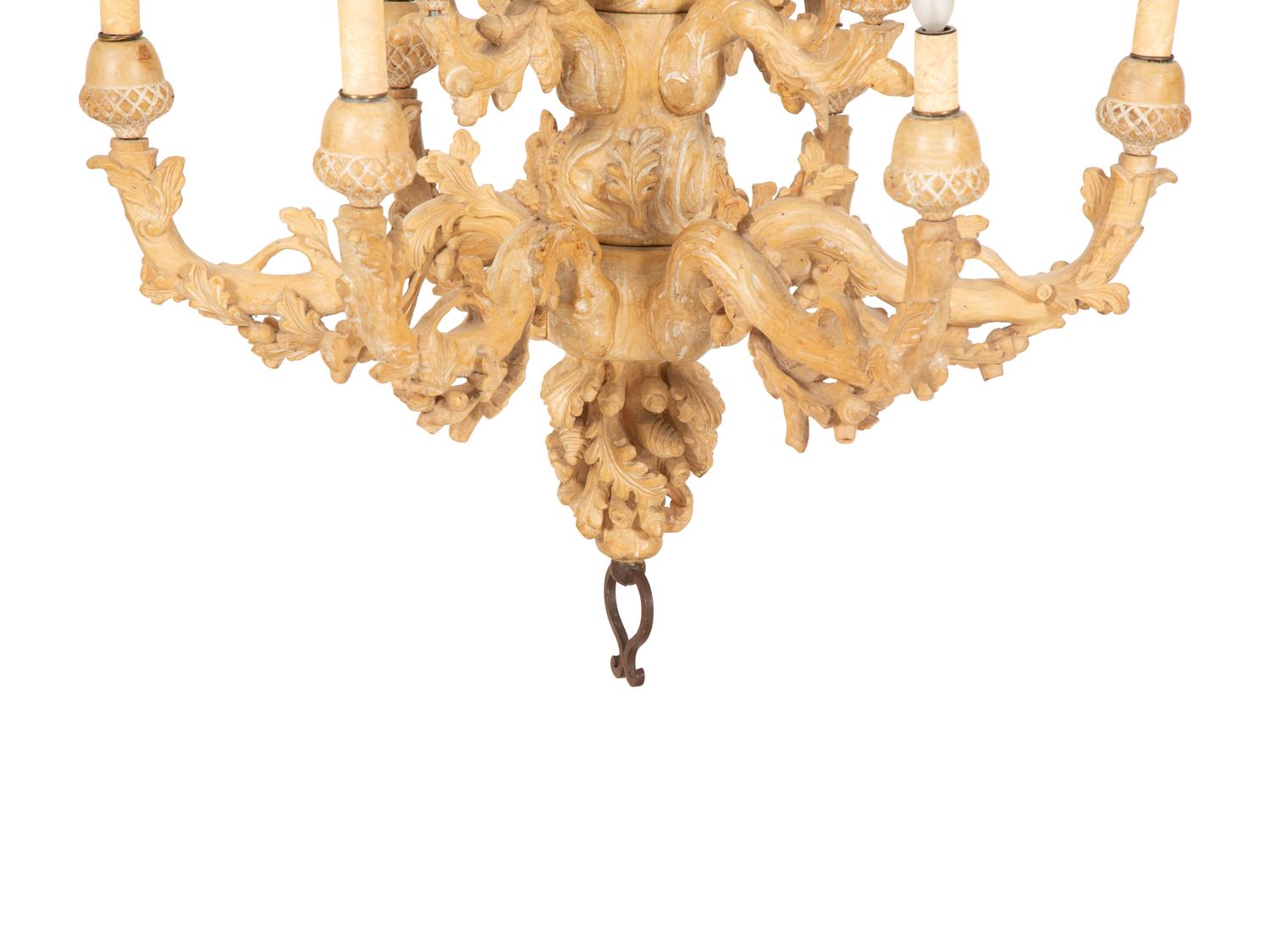 A Carved Fruitwood Ten Light Chandelier
