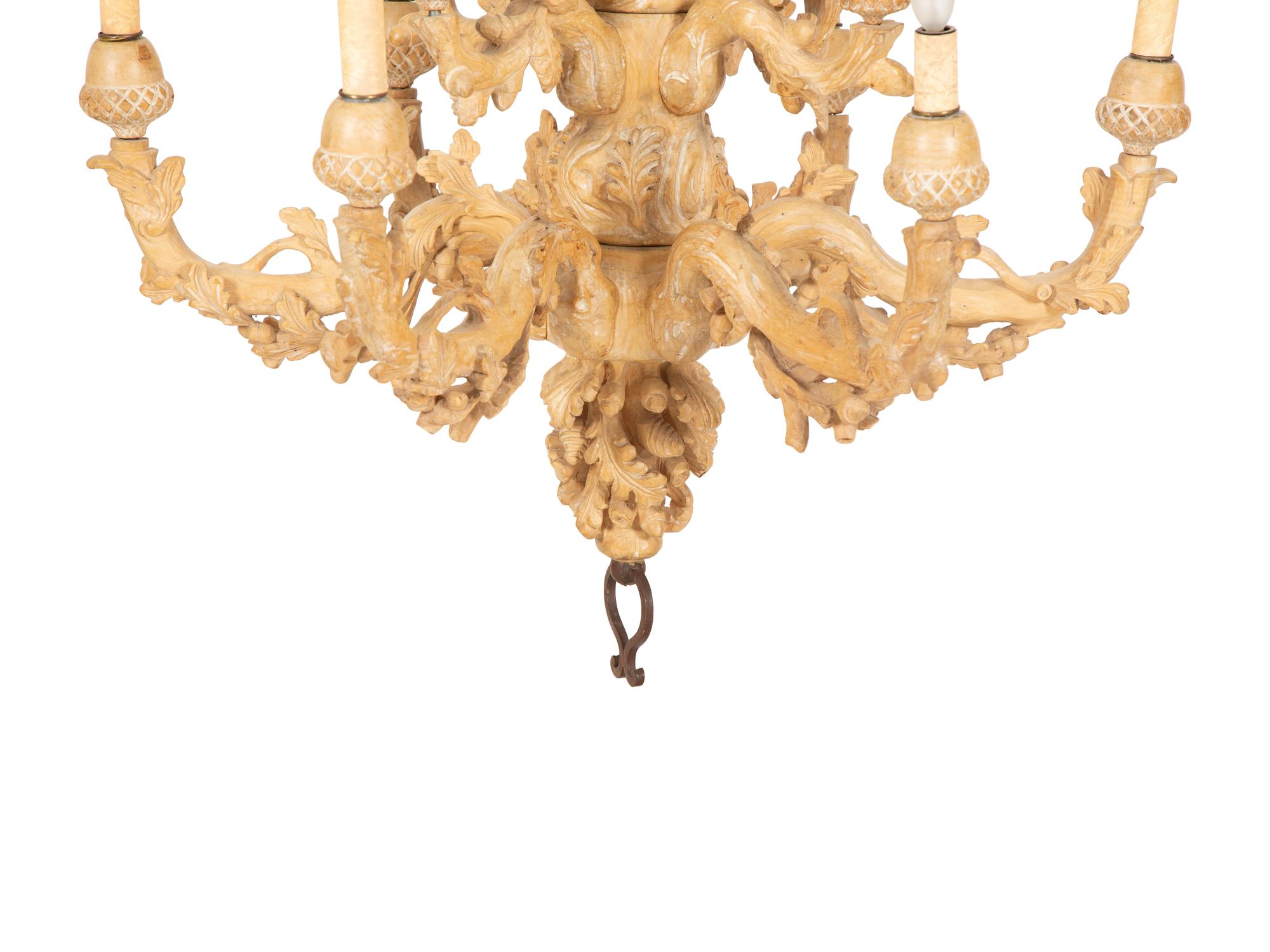 A Carved Fruitwood Ten Light Chandelier