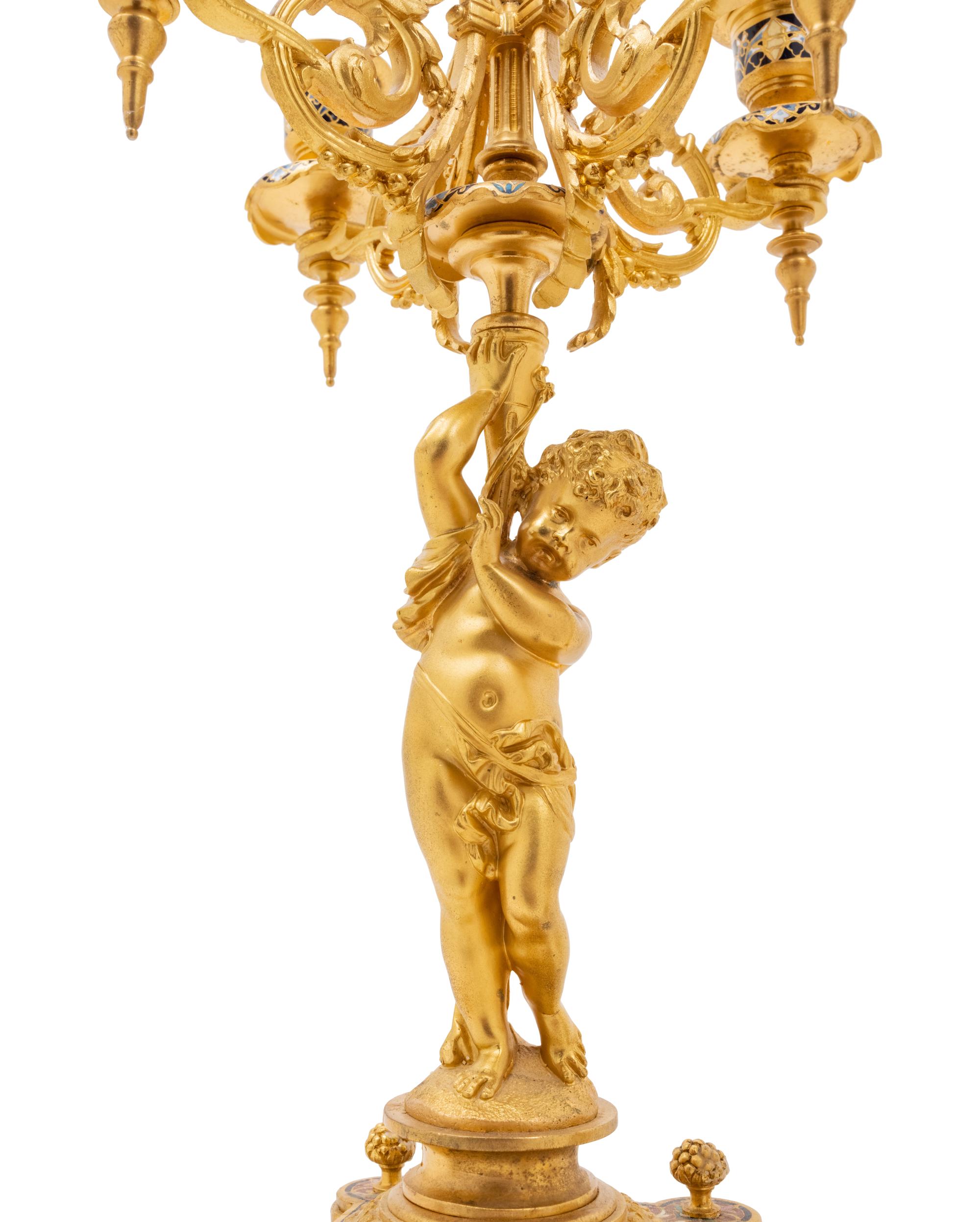 A Pair of French Gilt Bronze and Champlevé Five-Light Candelabra