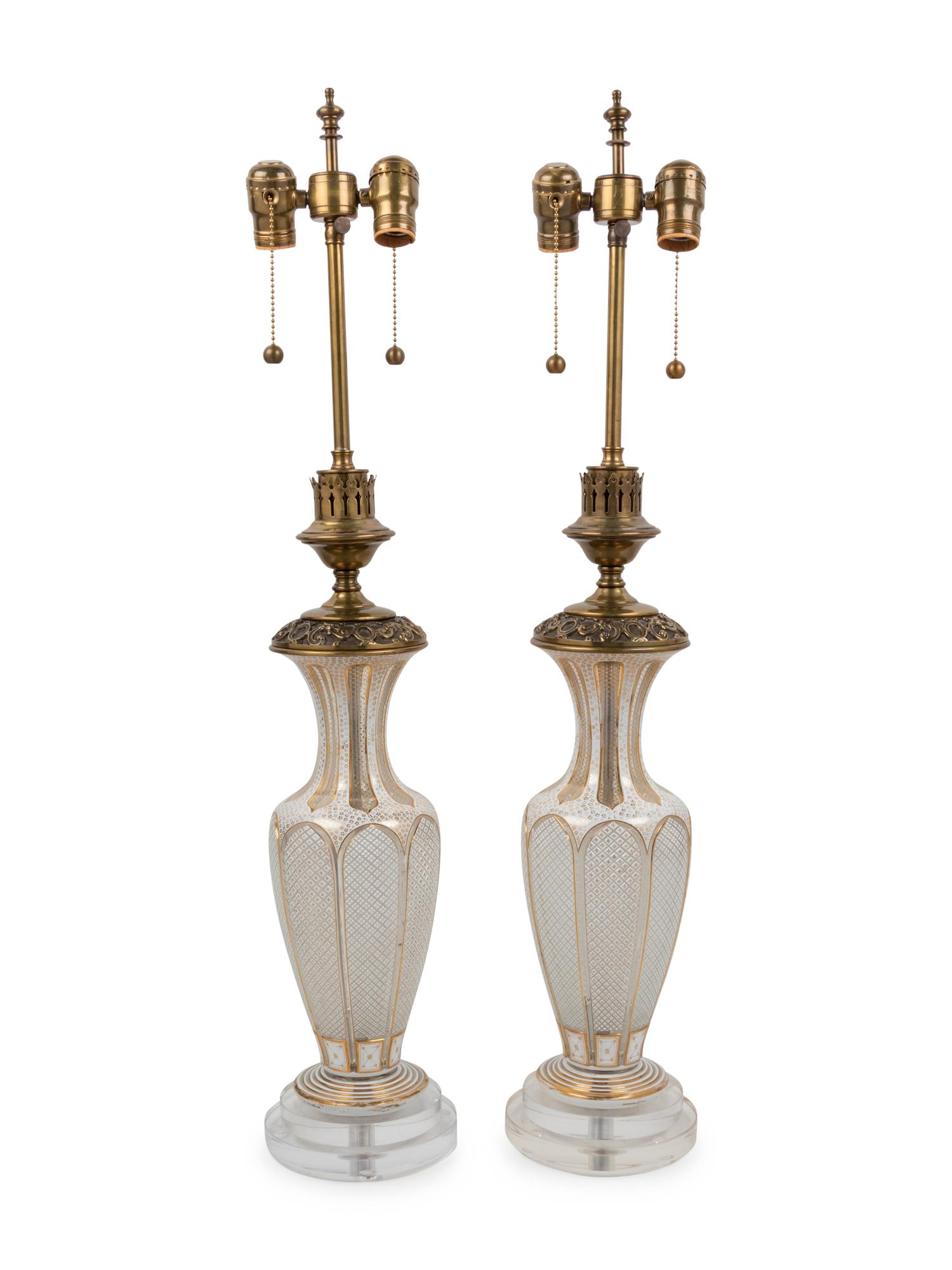 A Pair of Bohemian Parcel Gilt and Enamel Decorated Cut Glass Lamps