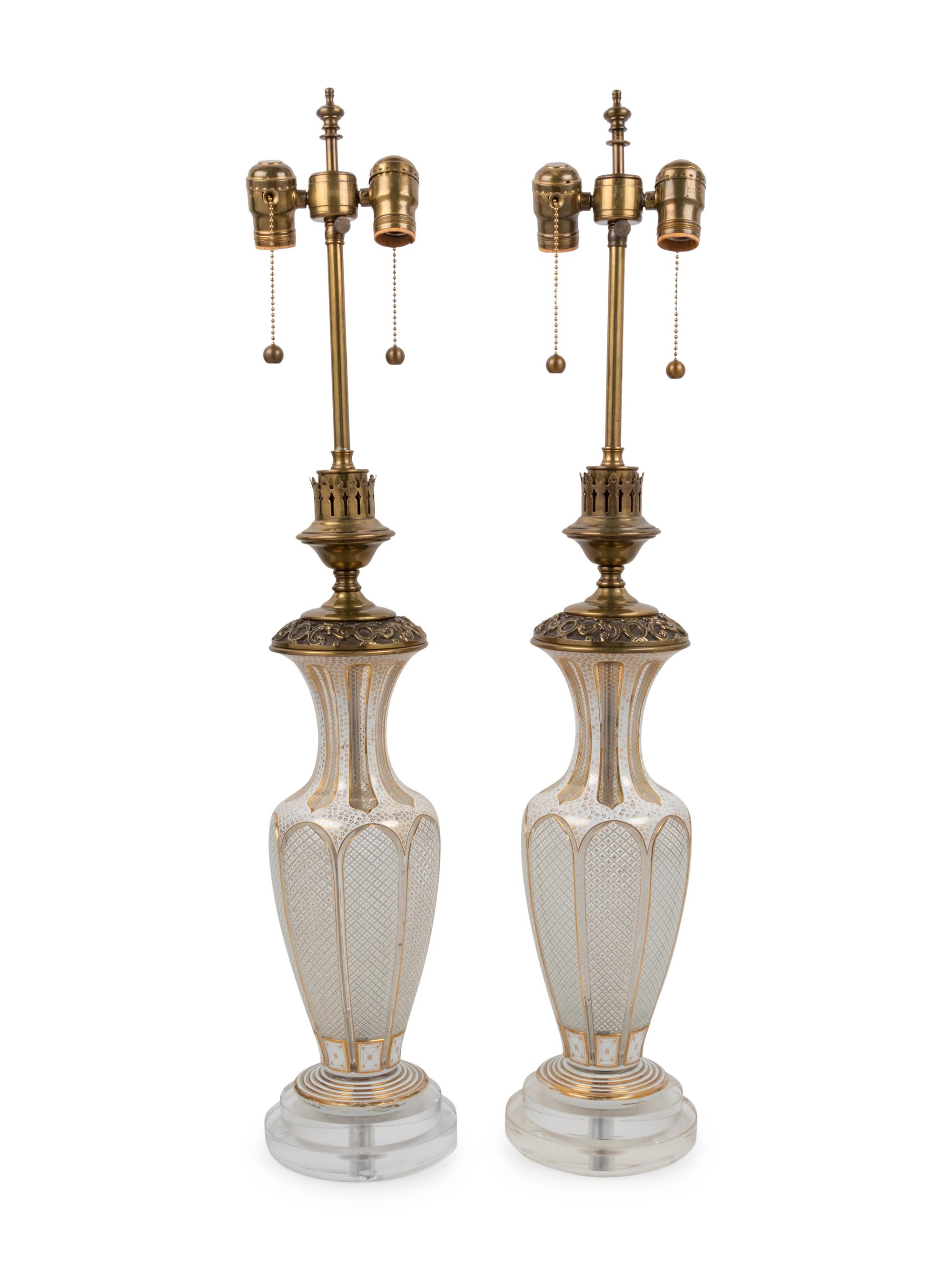 A Pair of Bohemian Parcel Gilt and Enamel Decorated Cut Glass Lamps