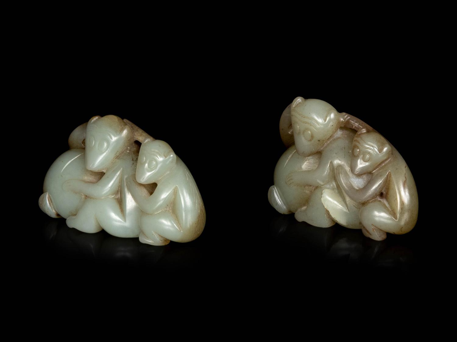Two Chinese Celadon and Russet Jade Carved Figures of Monkeys