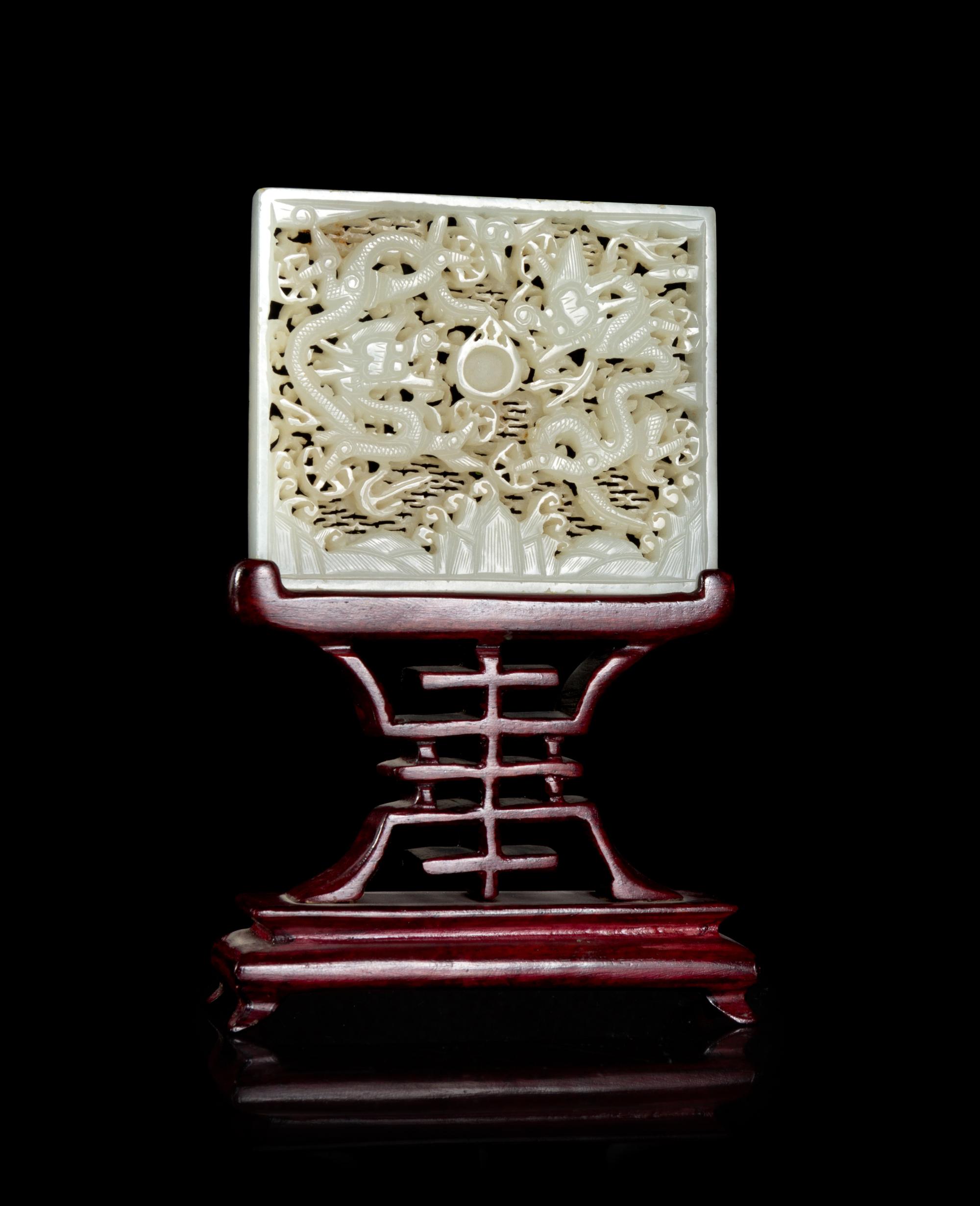 A White Jade Reticulated 'Dragon' Belt Plaque