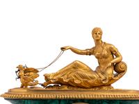 An Empire Gilt Bronze Mounted and Malachite Veneered Figural Mantel Clock