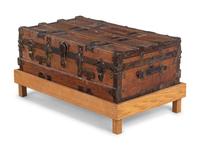 A Goldsmith & Son Never Break Trunk Raised on a Later Stand as a Table