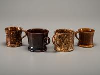 Fifteen Rockingham Glaze Mugs and Pig Banks