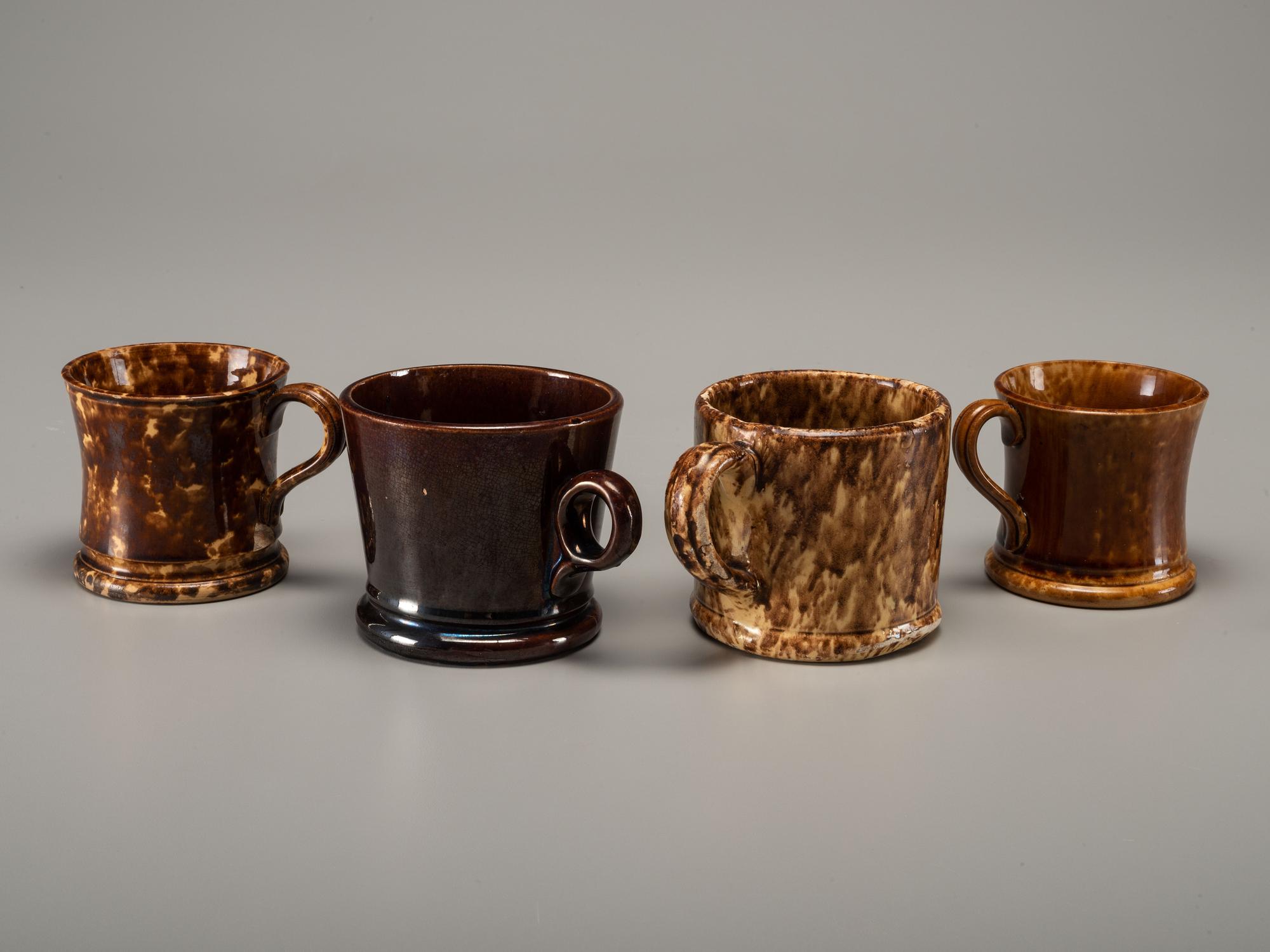 Fifteen Rockingham Glaze Mugs and Pig Banks