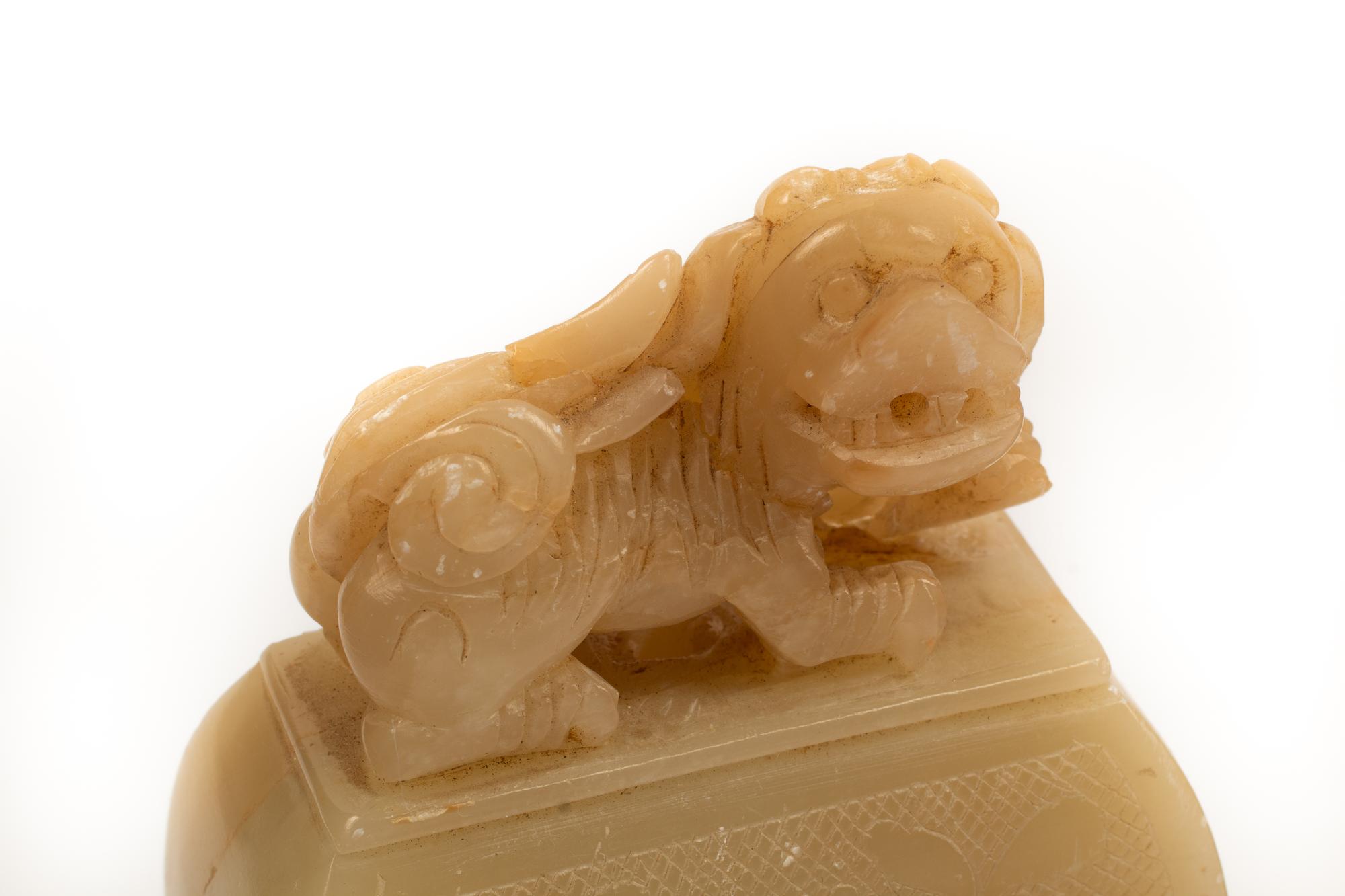 A Pair of Chinese Carved White Stone Jars on Wood Bases