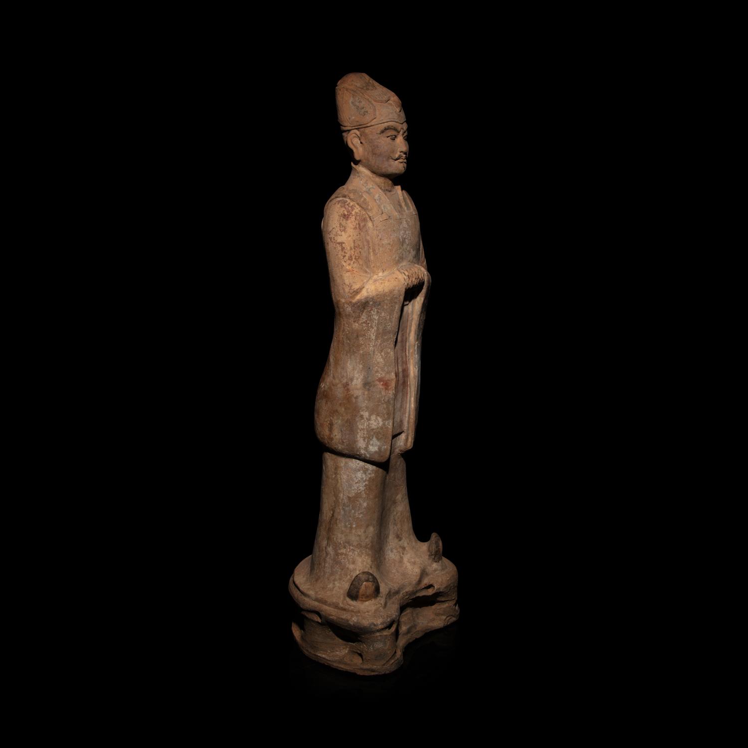 A Chinese Painted Pottery Standing Official, Tang Dynasty — 唐 陶加彩文官俑