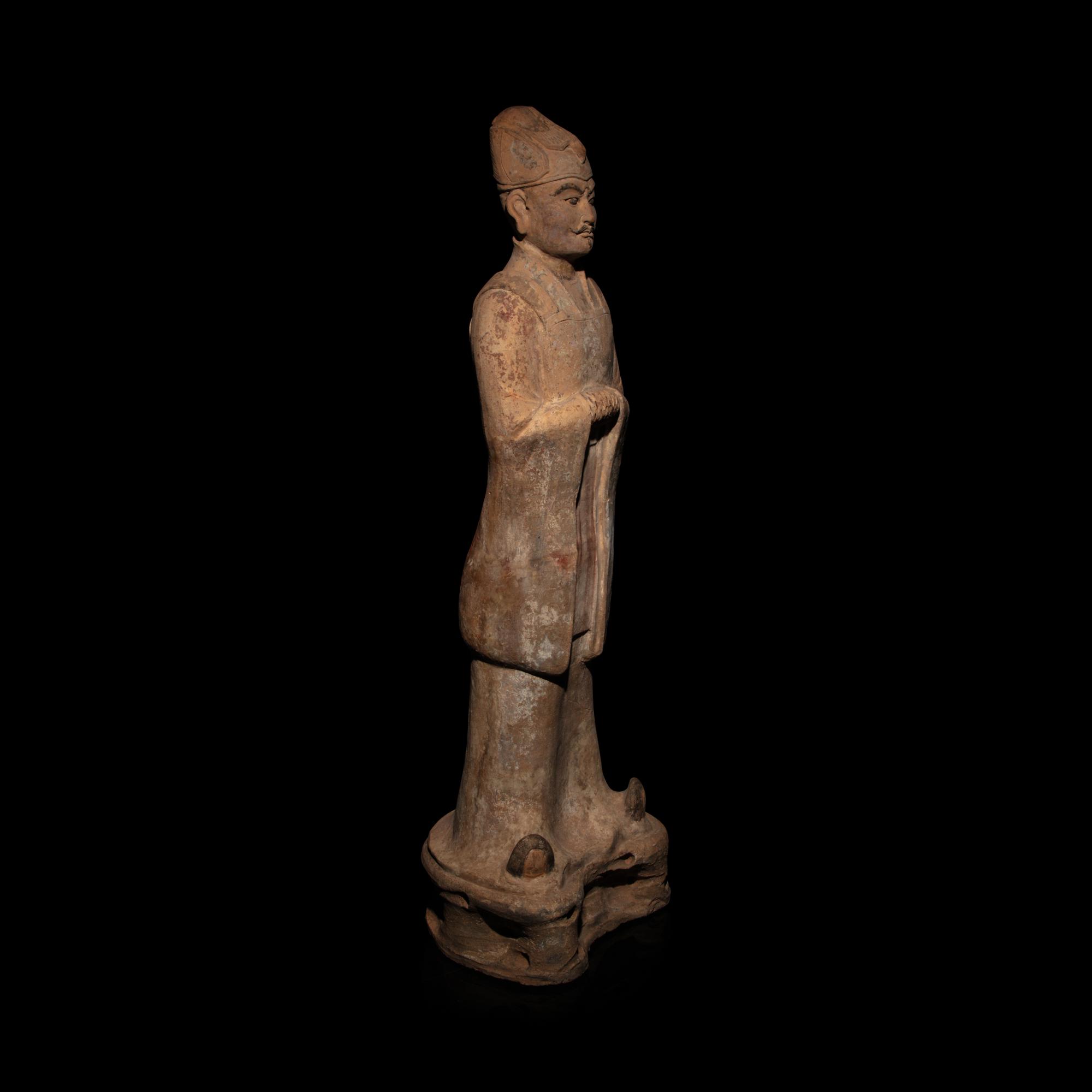 A Chinese Painted Pottery Standing Official, Tang Dynasty — 唐 陶加彩文官俑