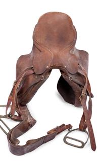 A Group of Three Leather Saddles, Including One by Abercrombie and Fitch