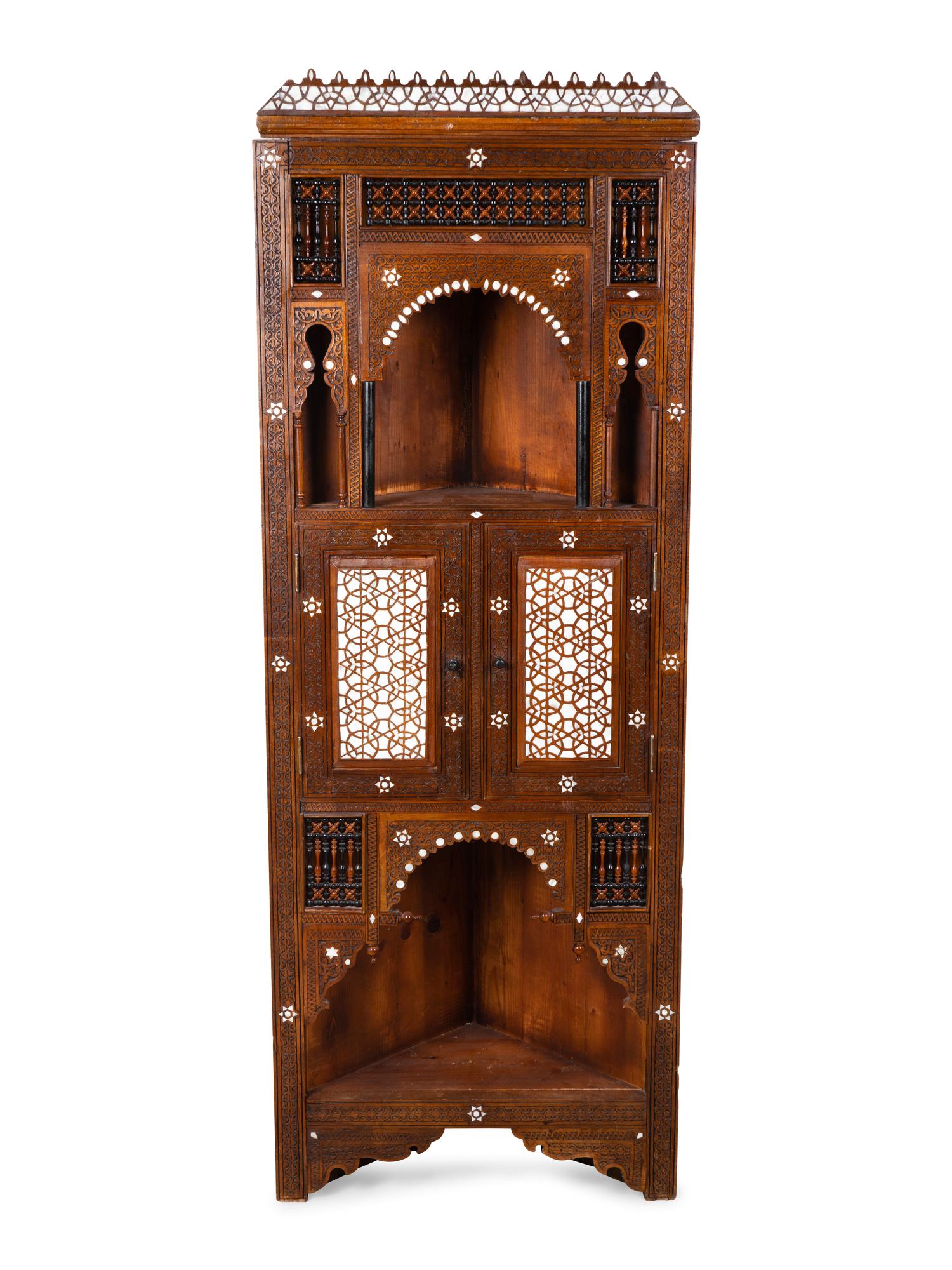 A Syrian Inlaid and Carved Wood Corner Cabinet — 19TH/20TH CENTURY