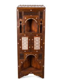 A Syrian Inlaid and Carved Wood Corner Cabinet — 19TH/20TH CENTURY
