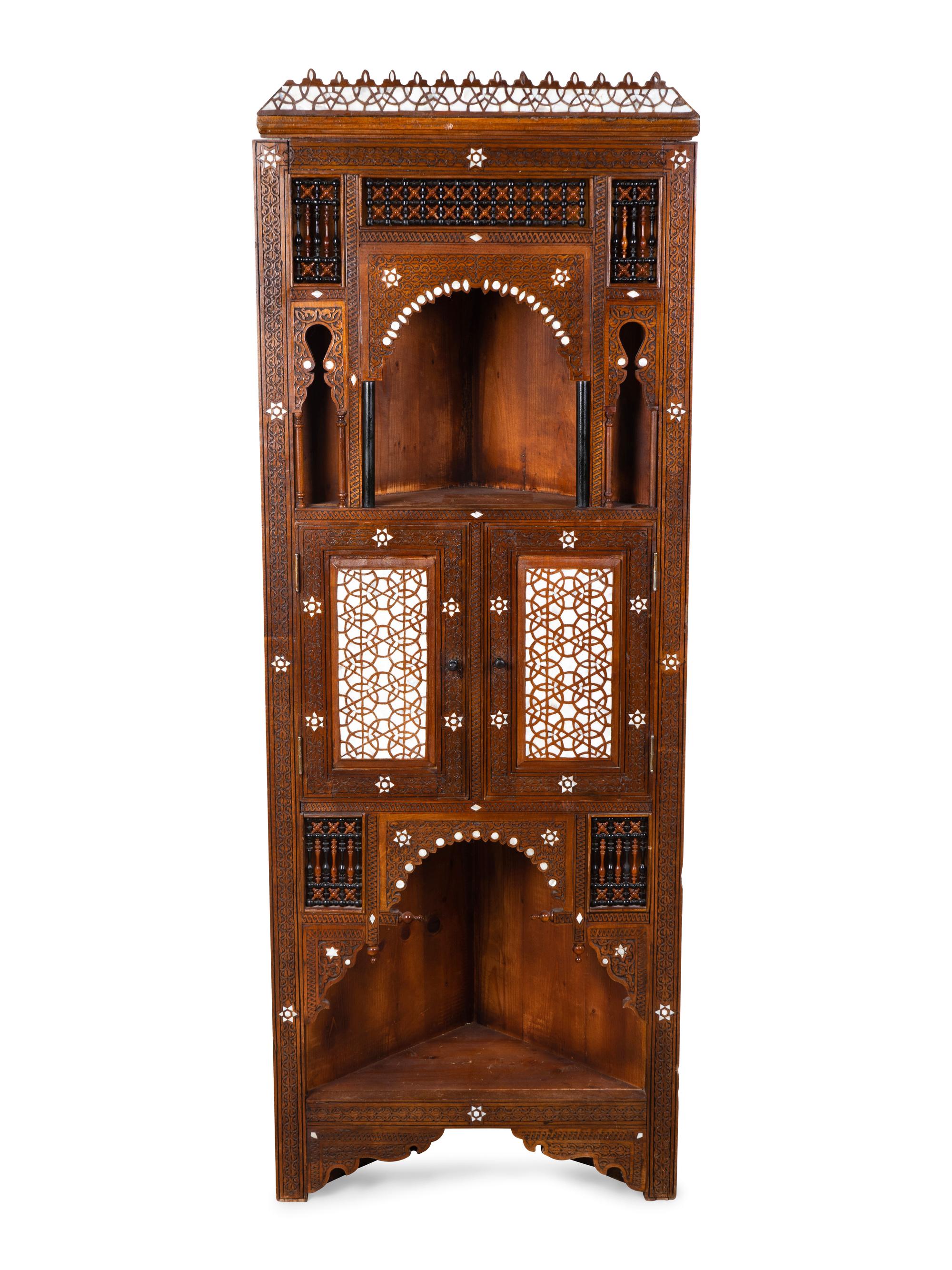 A Syrian Inlaid and Carved Wood Corner Cabinet — 19TH/20TH CENTURY